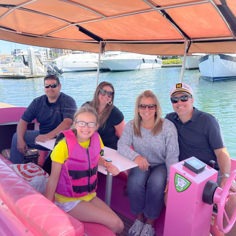 a group of people on a boat in the water