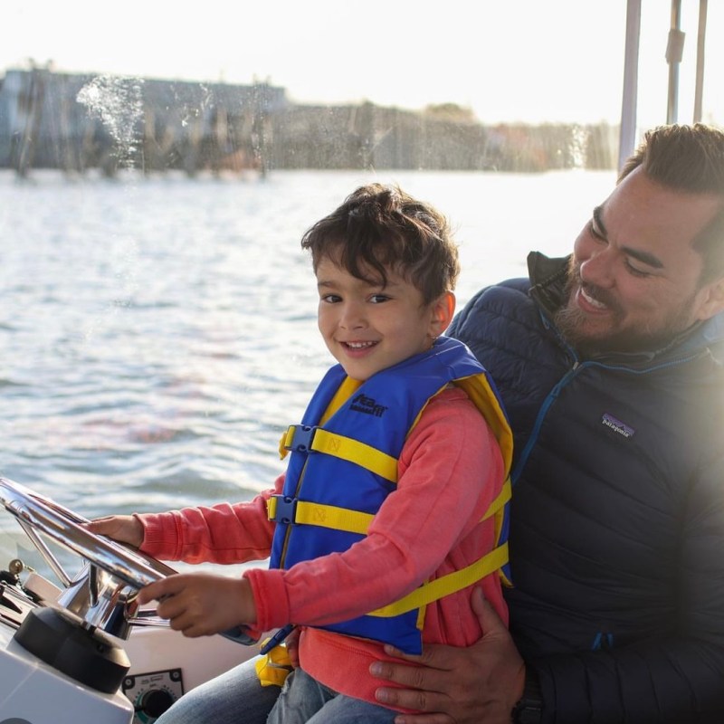 a man riding on the back of a boat