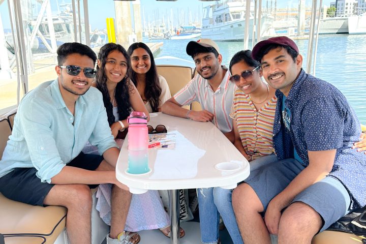 Mohsin Khawar et al. sitting posing for the camera