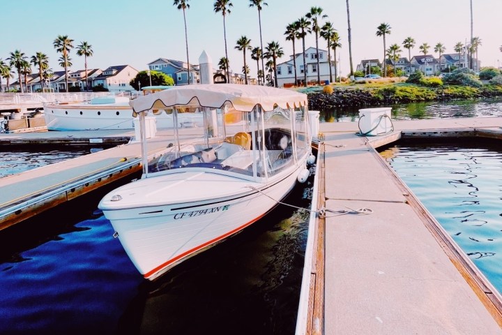 a boat is docked next to a body of water