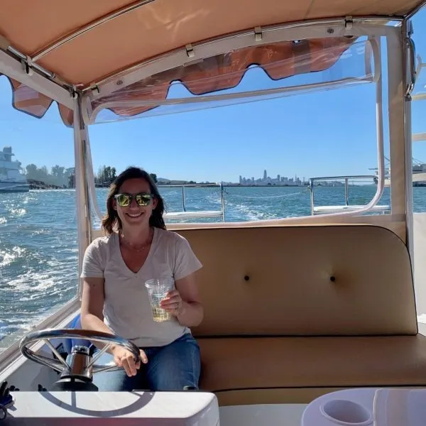 a person sitting on a boat in the water