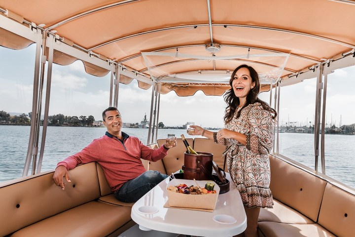 a woman sitting on a boat in the water