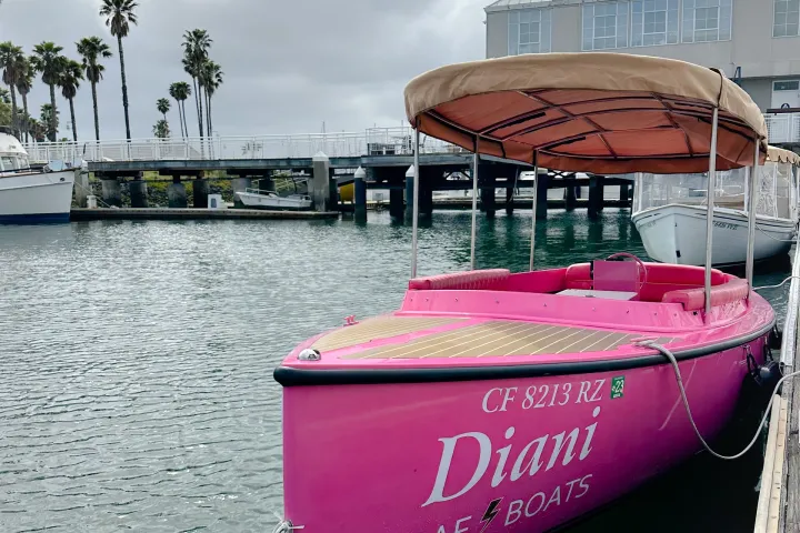 a boat parked next to a body of water